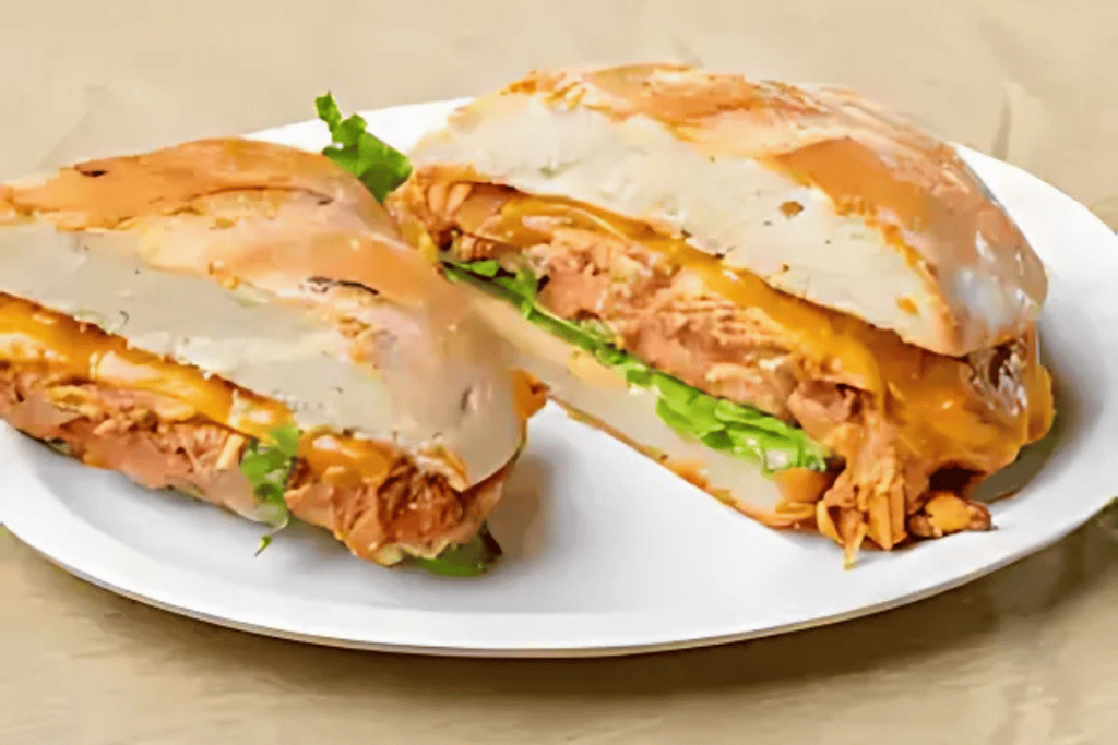 chicken bomb sandwich with melted cheese on toasted bun