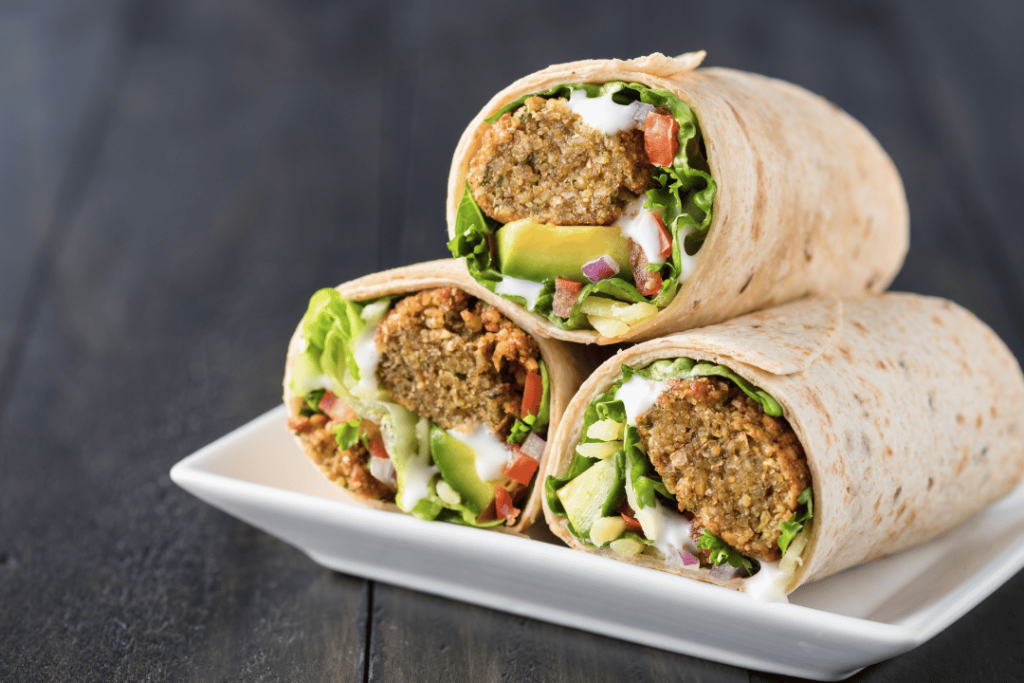 falafel sandwich with lettuce and tomato
