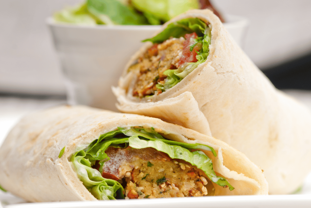 pita wrap with hot sauce and sides